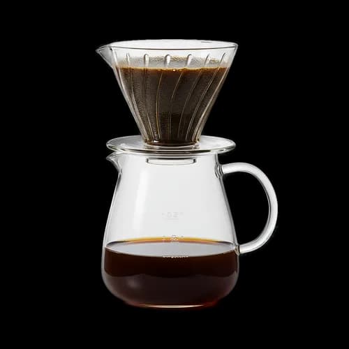 Glass coffee dripper with fresh brewed black coffee