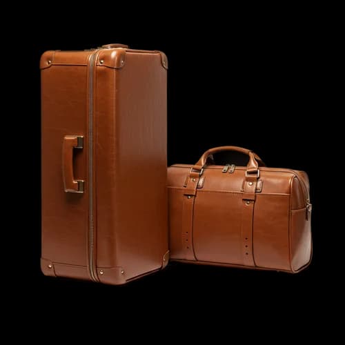 Two vintage brown leather suitcases for travel