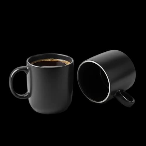 Two black coffee mugs with hot espresso