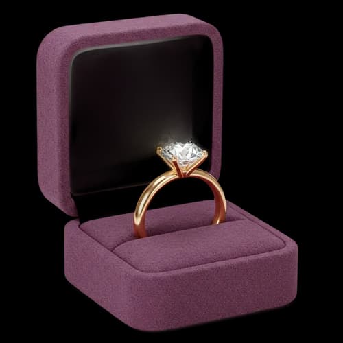 Diamond engagement ring in a purple velvet jewelry box