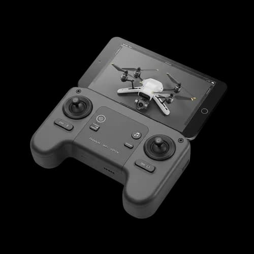 Black drone remote controller with a smartphone attached
