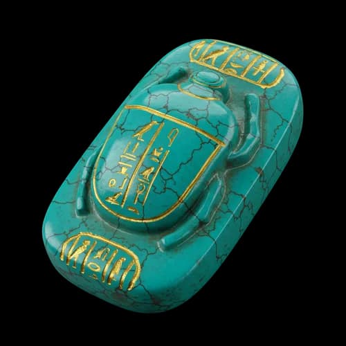 Ancient egyptian turquoise scarab beetle amulet with gold