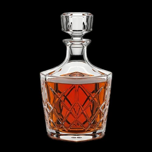 Crystal glass decanter filled with golden amber whiskey