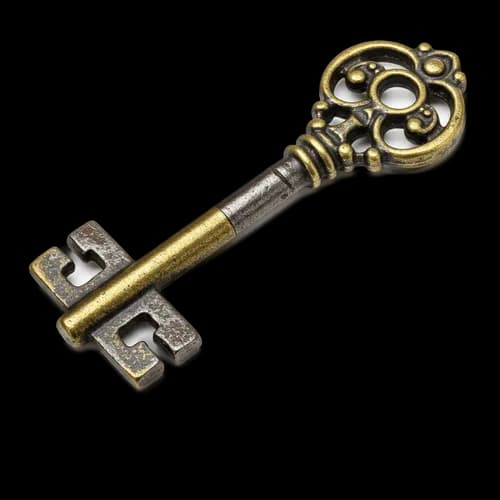 Old vintage brass key with ornate handle design