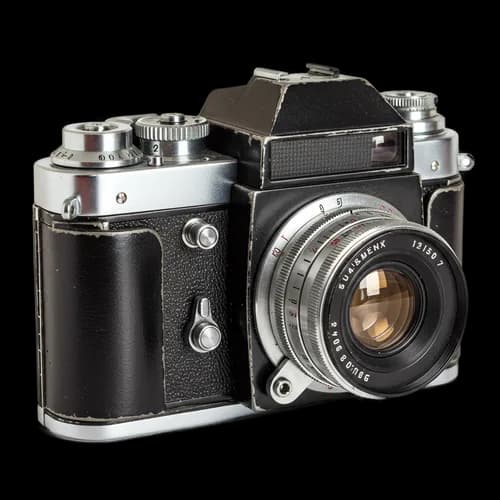 Vintage black film camera with metal lens
